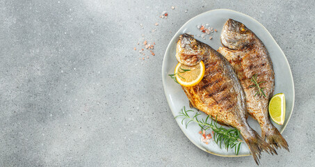 Grilled dorado fish and lemon. Healthy food. roasted dorado. Detox and clean diet concept. place...