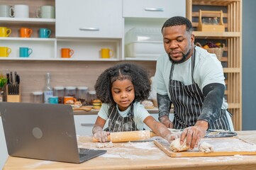 african afro black daughter kids with dad father and mom enjoy cooking class family funny internet...
