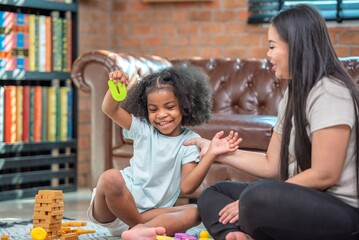 african afro black daughter kids with mom enjoy play game learn education class family funny in living room at home. Black african family afro hair enjoy for learn literacy preschooler in home