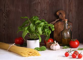 ingredients for making pasta - tomatoes, basil, garlic