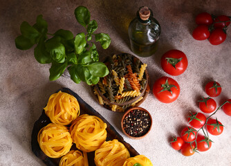 ingredients for making pasta - tomatoes, basil, garlic