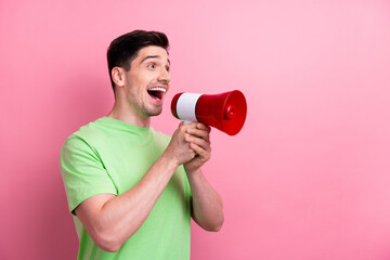 Photo of young excited crazy funny man holding megaphone announce mega sale black friday coming soon isolated on pink color background