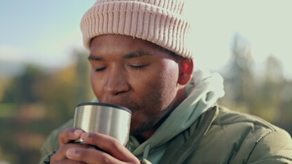 Coffee, camping and relax with black man in nature for adventure, travel and vacation. Morning, freedom and holiday with person drinking tea from mug in outdoors for peace, happy and smile