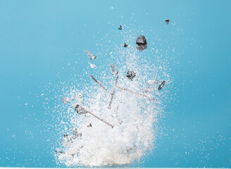 Nail spike Nut bolts sharp object rock stone under snow on road roof. Dangerous nail screw rock object hidden in snow. Snow fall with risk accident cover trash. Blue sky winter background isolated