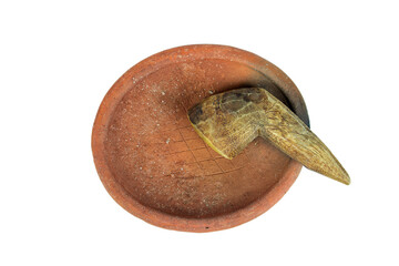 Traditional mortar and pestle made of clay and wood on a white background