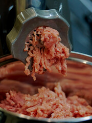 meat is minced in a meat grinder