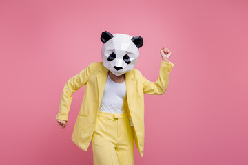 Portrait of crazy overjoyed 3d panda mask elegant lady have good mood dancing discotheque isolated on pink color background