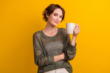Photo portrait of pretty young girl hold coffee cup enjoy pause wear trendy knitwear khaki outfit...