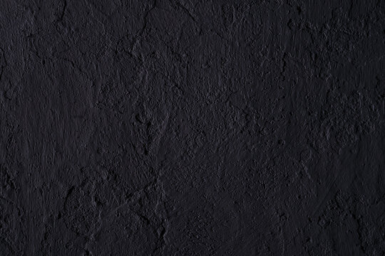 Abstract black concrete texture, background with copy space