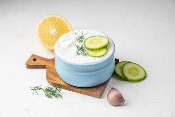 Greek cuisine, tzatziki sauce on a light background