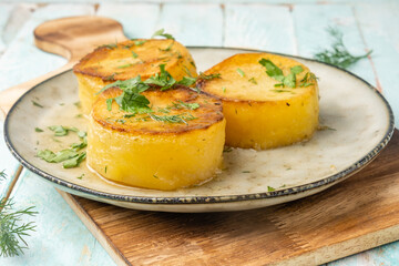 Tender potato fondant on a plate, delicious potatoes