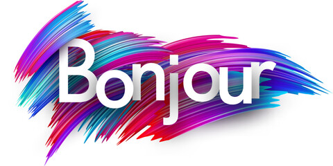Hello at French paper word sign with colorful spectrum paint brush strokes over white. © Vjom