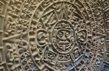 Ancient Mayan Calendar or Aztec calendar with rough relief surface outdoors