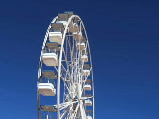 White ferris wheel with blue sky