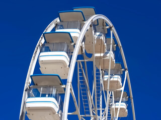 White ferris wheel with blue sky