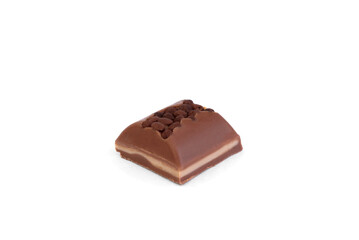 Piece of milk chocolate with filling and decorated with crumbs isolated on white background.