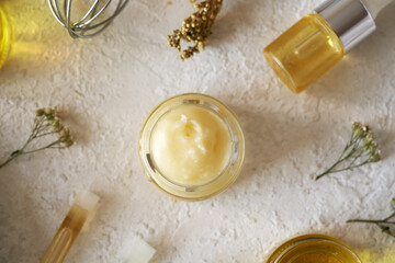 Shea butter with herbs and essential oils, top view - obrazy, fototapety, plakaty