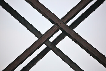 train trestle steel bar detail forming an x shape, abstract (moodna viaduct) close up of metal...