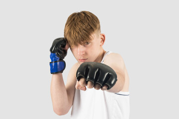Teenage boxer boy punching