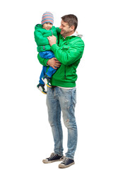 Happy dad holding his son, standing together wearing winter clothes on white background