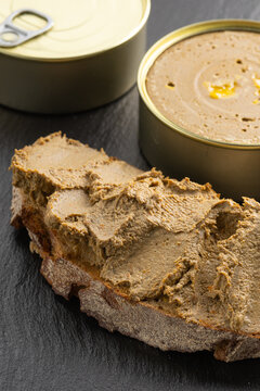 liver pate on the breakfast bread one tin can full and open with fuagra
