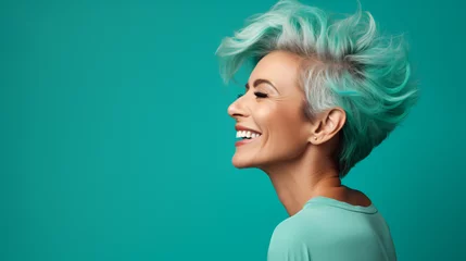  Profile side photo of mature cheerful pretty lady have fun clubber look empty space isolated over turquoise color background © Karol