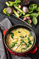 chicken spinach artichoke creamy soup in a pot