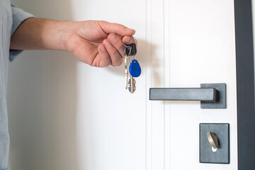 The keys to the new apartment are in men's hands
