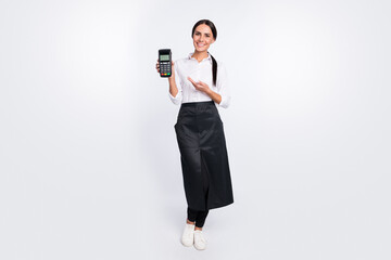 Photo portrait of cheerful waitress keeping bank terminal in cafe isolated on white color background