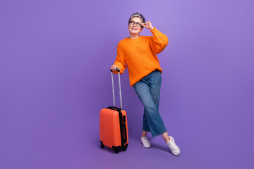 Full body photo of attractive grey hair businesswoman touch glasses holding suitcase dreamy look...