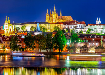Prague castle with St. Vitus cathedral and Charles bridge at night, Czech Republic
