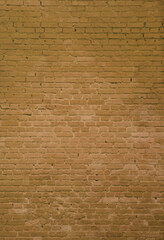 The texture of the brick wall of many rows of bricks painted in brown color