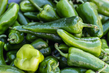 Fresh pepper for sale in a wooden box at a local farmers market in the fall
