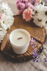 Obraz na płótnie Canvas Minimalistic candle with flowers, beautiful photo