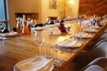 The festive table is covered with dishes, napkins, and glasses.