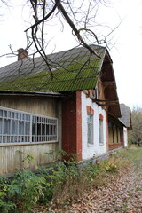 A building with moss growing on the roof