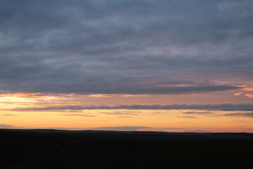 A sunset over a field