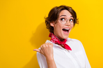 Photo of beautiful young crazy omg lady indicating finger presentation advertisement brand logo isolated on yellow color background - obrazy, fototapety, plakaty