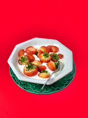Strawberries on a red background