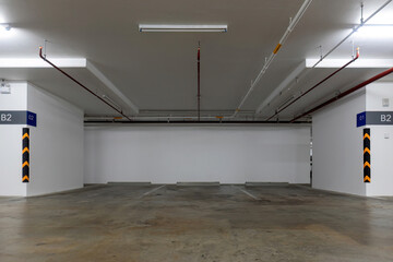 Empty car park with blank wall. space parking garage building and space wall. car park  indoors....