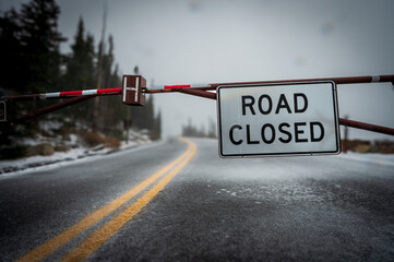 road closed sign in snow - Powered by Adobe