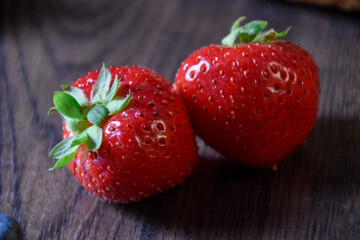 Fresh strawberries and blueberry on the wooden rustic table healthy food