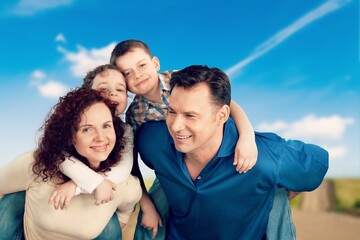 Happy family play together in the park