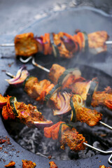 Fototapeta premium Moroccan fish kebab on the outdoor grill .style rustic