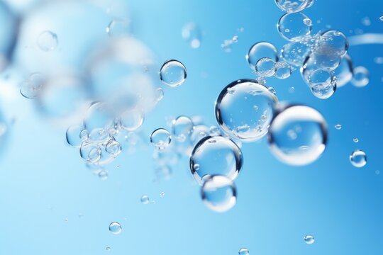 Close-up macro photo of water drops or oil bubbles on blue background.