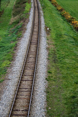 Fototapeta premium Railway bed. Fragment of railway tracks, top view, rails and sleepers.