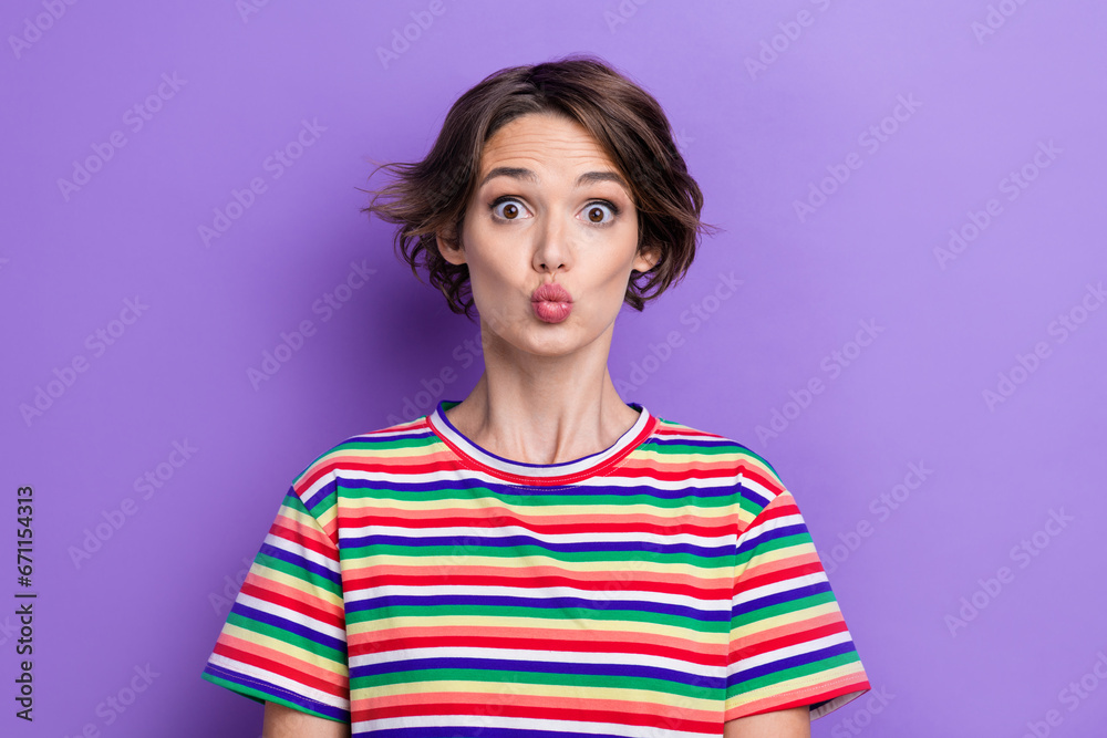 Poster portrait of impressed gorgeous girl pouted lips kiss impressed reaction isolated on purple color bac