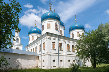 Fototapeta premium View of the Cathedral in honor of the Exaltation of the Precious and Life-Giving Cross of the Lord on a sunny July day. St. George's Monastery, Veliky Novgorod. Russia