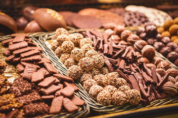 Close up. Different types of cookies in chocolate on the counter at a Spanish bazaar.