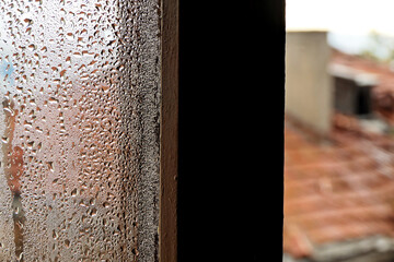 raindrops on the window of an old house